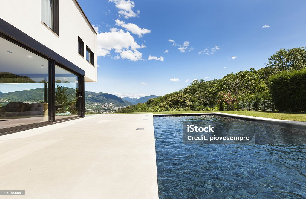 Modern villa with swimming pool Modern villa , outdoor, view from poolside Architecture Stock Photo