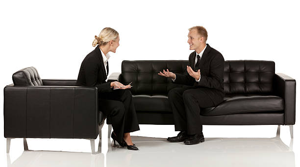 istock Business executives discussing sitting on couch 454357597
