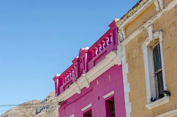 The Colourful Bo Kaap situated in Cape Town in the Western-Cape is a great Tourist Spot. Pigeons on colourful sills.