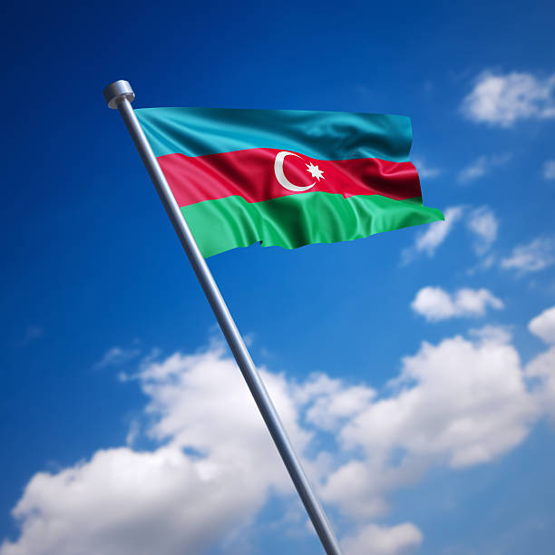 Flag of the Republic of Azerbaijan on modern metal flagpole. Shallow depth of field and motion blur 3d render.