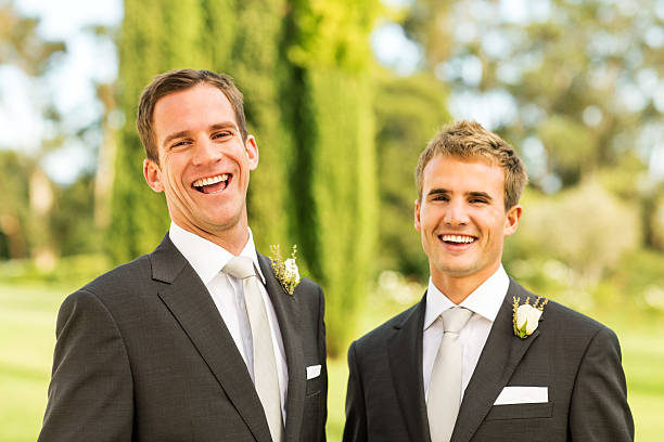 istock Groom And Best Man Laughing Together In Garden 454366557