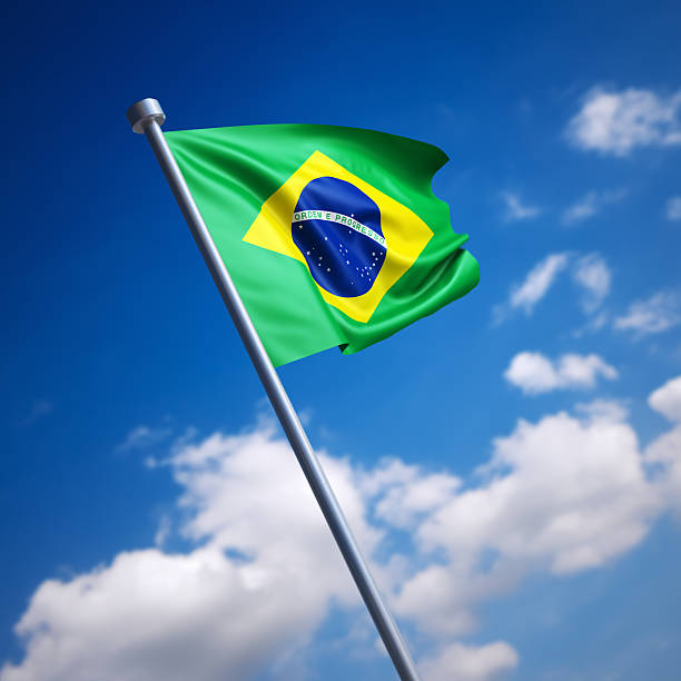 istock Flag of Brazil against blue sky 454374057