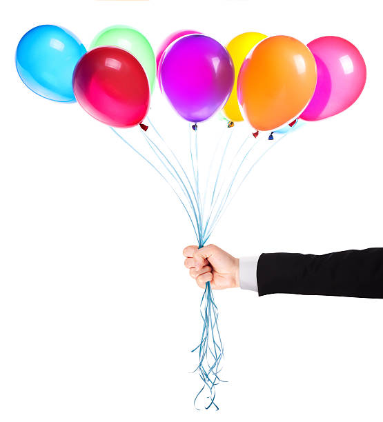 istock flying balloons with Businessman hand 454378755
