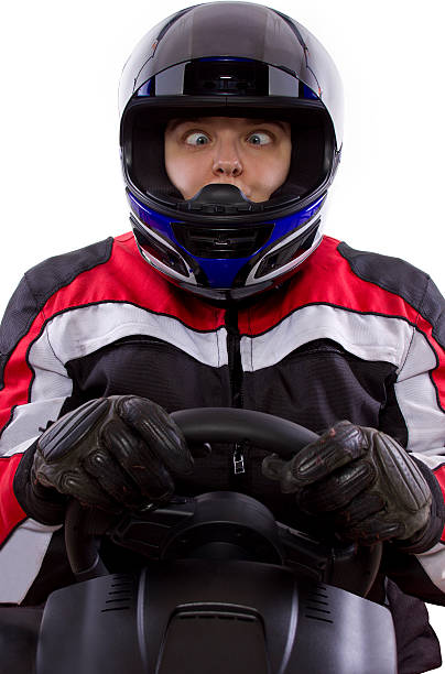 istock Female Racer Wearing a Helmet on a White Background 454379391
