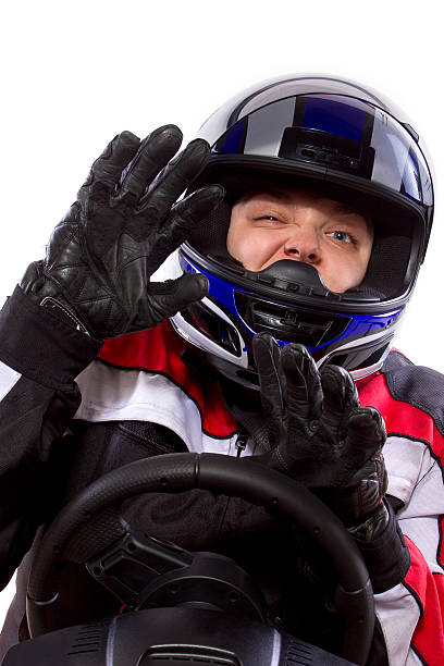 istock Female Racer Wearing a Helmet on a White Background 454380323