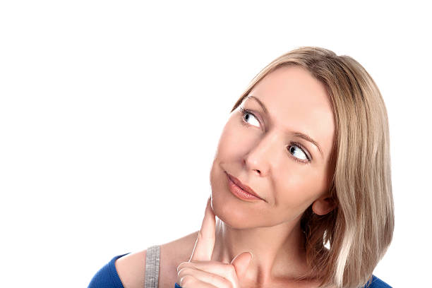 istock Beautiful young woman thinking 454380845