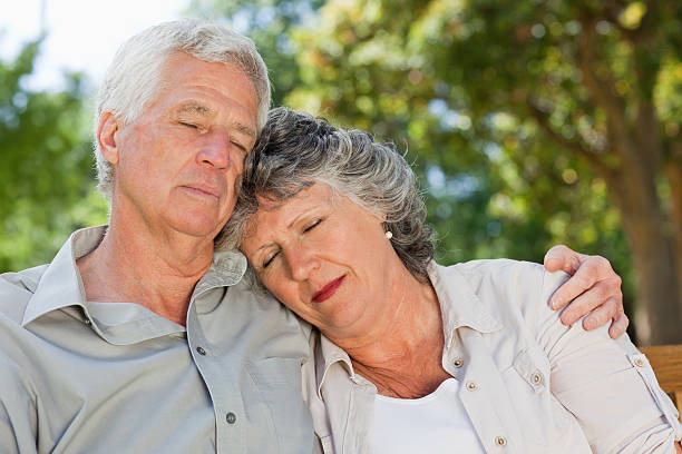 istock husband and wife sleeping outdoors 454384865