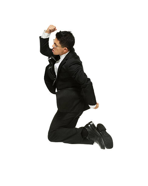 istock Young successful businessman jumping 454388033