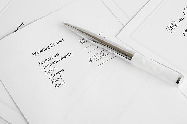 Pen on wedding budget plan (close-up) stock photo