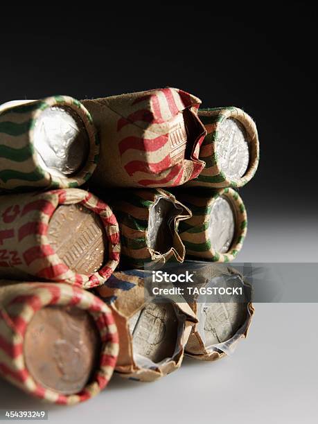 Stack Of Us Coin Rolls Stock Photo - Download Image Now - American Culture, Black Background, Business