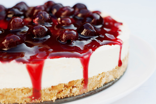 Homemade Cheesecake with cherries, cherry topping and mascarpone cream.