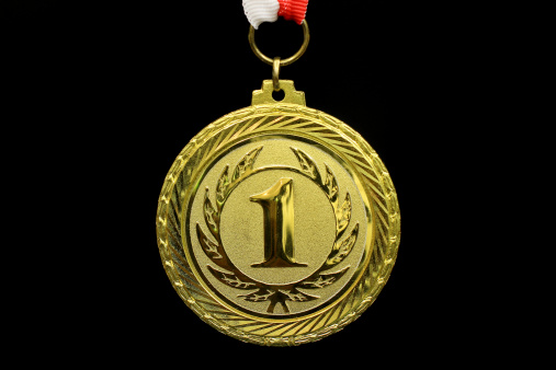 Gold medal winner, black background, horizontal