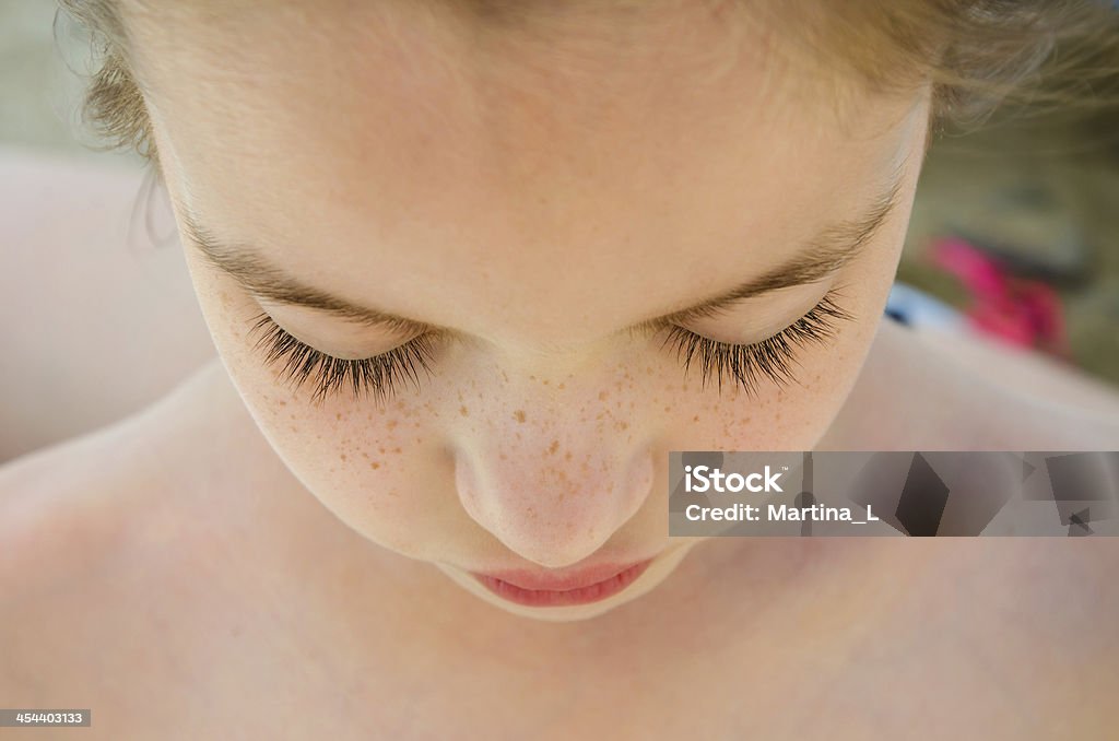 Beautiful Freckle Face Girl with closed eyes Beautiful Freckle Face Girl with closed eyes, close-up Close-up Stock Photo