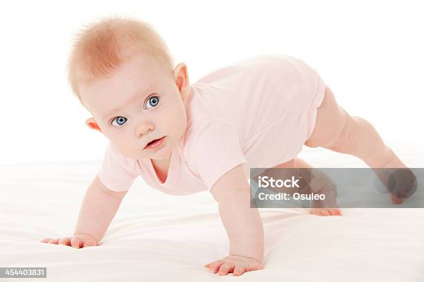 Cute Baby With Beautiful Blue Eyes On The White Bed Stock Photo - Download Image Now