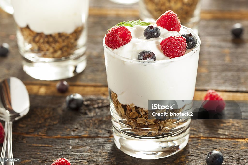 Homemade Organic Fresh Fruit Parfait Homemade Organic Fresh Fruit Parfait with berries and granola Berry Stock Photo