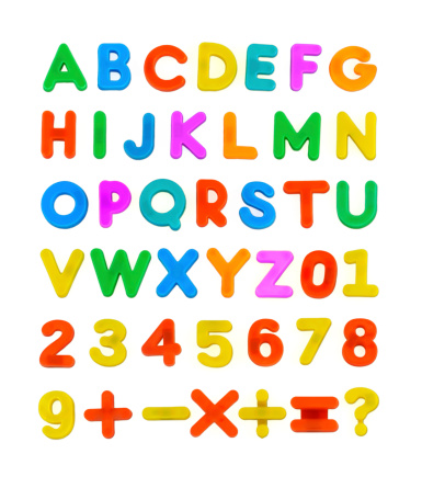 A Child's magnetic plastic ABC Letters laid out Alphabetically.