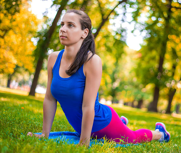istock Athletic Woman - Stretches 454413241