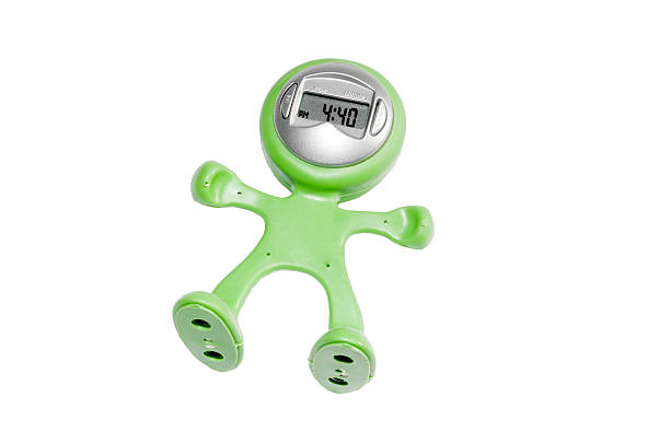 Green human shaped watch isoalted stock photo