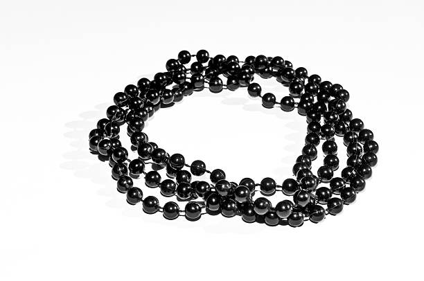 Black beads isolated stock photo