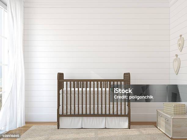 Brown Crib Against White Brick Wall Near Window Stock Photo - Download Image Now - Crib, Nursery - Bedroom, Old-fashioned