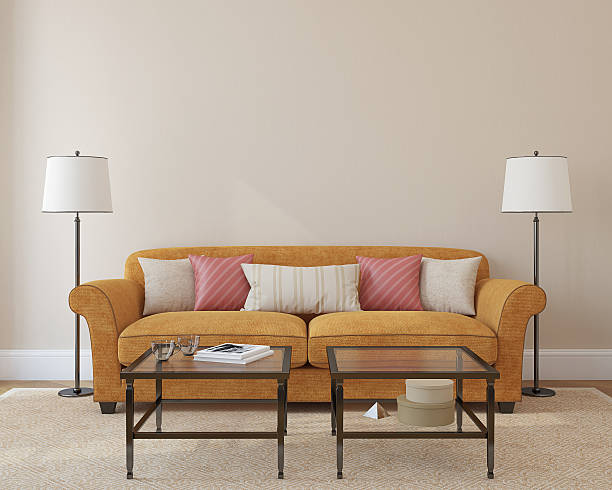 istock A couch, two lamps and two tables in a living room 454416687