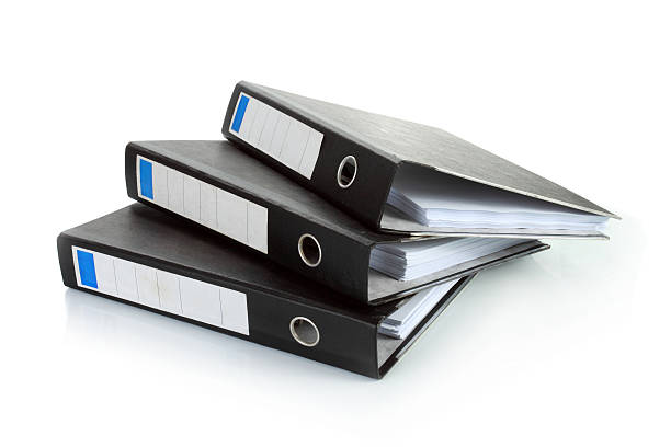 Stack of documents in binders Stack of documents in binders against white background. Office life. tabs ring binder office isolated stock pictures, royalty-free photos & images