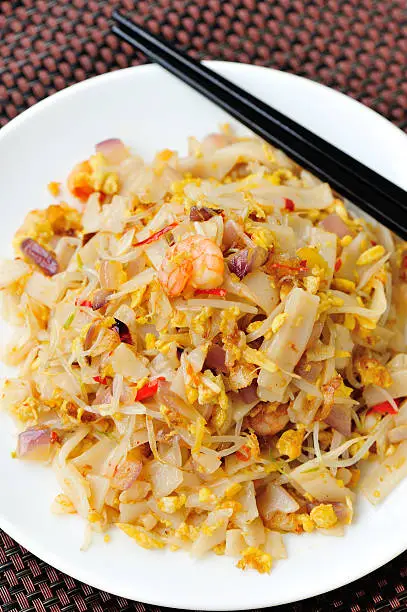 stir fried chinese flat rice flour noodles with shrimp and vegetables