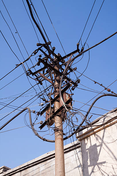 Tangled Wires Wire pole mess,was taken in Haerbin,Heilongjiang province of China. complexity messy chaos house stock pictures, royalty-free photos & images