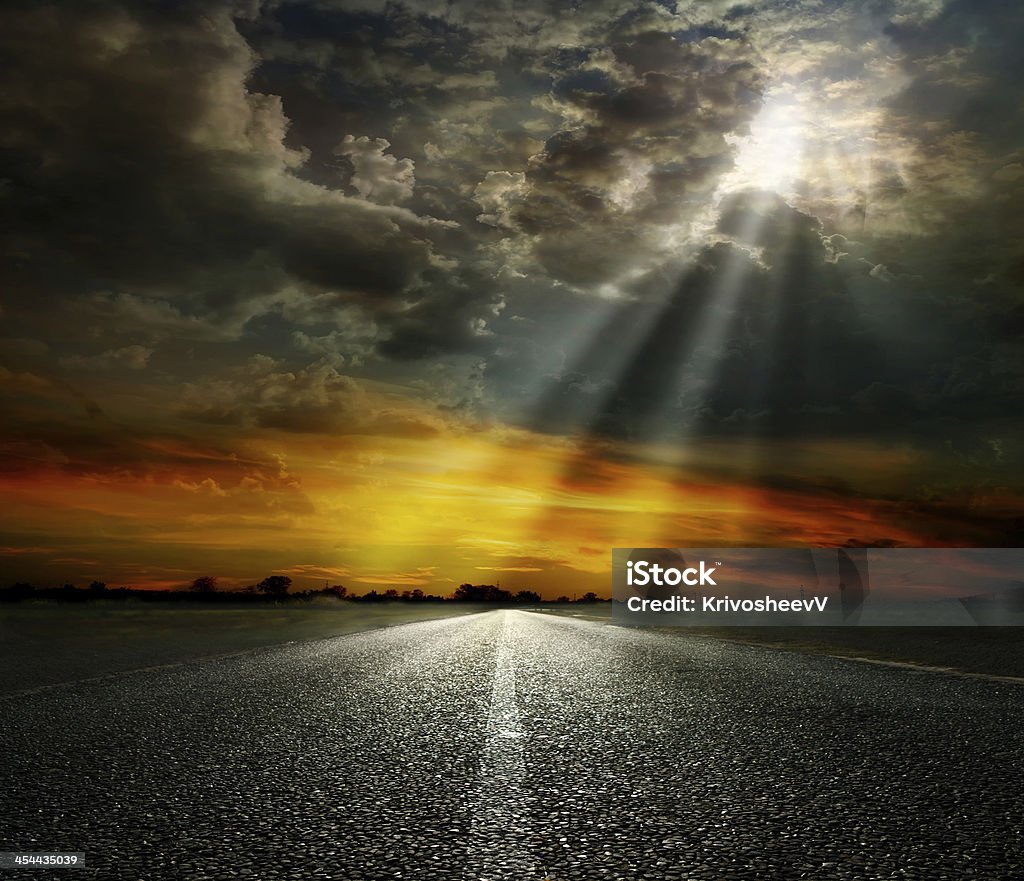 asphalt road Dramatic sky over an asphalt road Asphalt Stock Photo