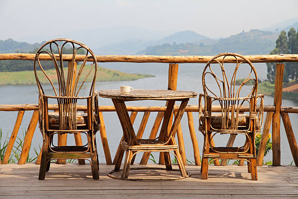 istock Wicker Chairs and Table with Coffee on a Lake View 454909549