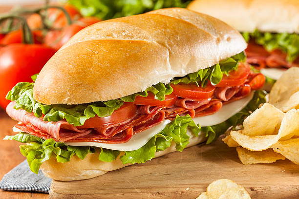 italiano casero sub sándwich - sandwich submarine delicatessen salami fotografías e imágenes de stock
