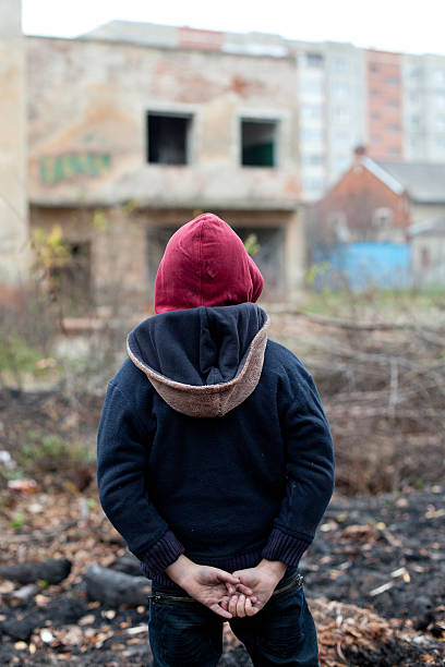istock young homeless boy on the street 454924161