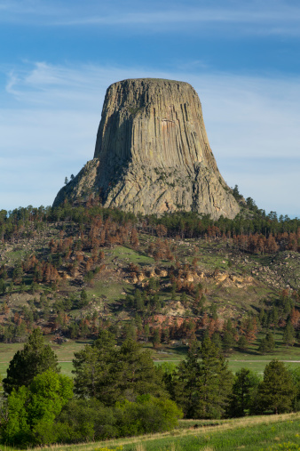 A rock formation on top of a hill.