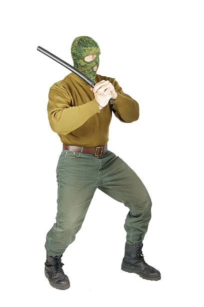 сильный человек хочет войти с резиновой club - pants green camouflage men стоковые фото и изображения