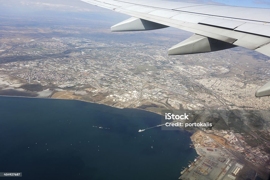 View from the plane Wing of airplane flying above the clouds in the sky Abstract Stock Photo