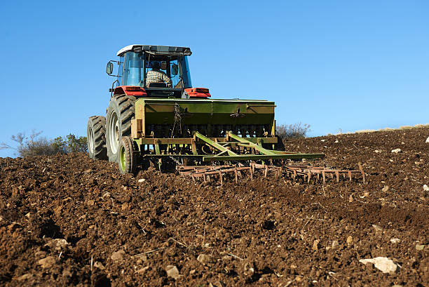 istock agricultural tractor sowing seeds 454932337