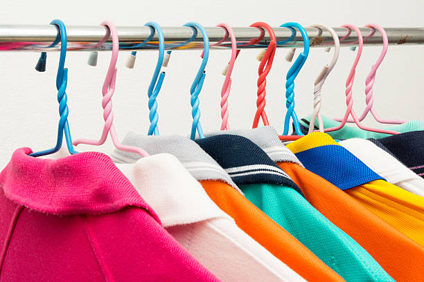 istock Colorful T-shirts on hangers 454938275