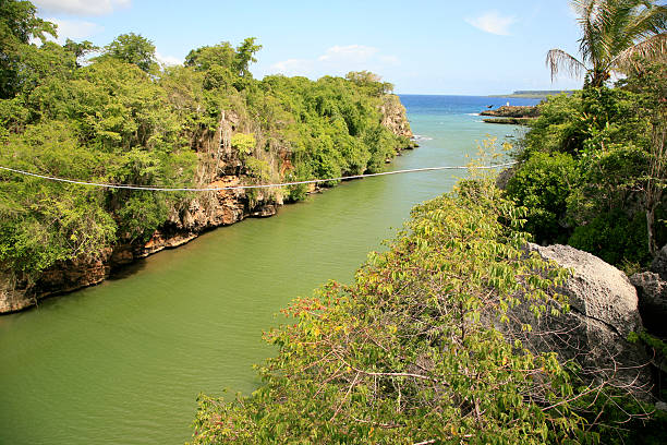 Yuma river mouth flows with its jade color waters into Caribbean sea and a short boat trip on the river is a enchanting moment because of the surrounding wild nature and birds like egrets and pelicans flying close by the boat. Boca de Yuma is a village in the province of La Altagracia, in the Dominican Republic. It is situated west of the mouth of the Rio Yuma, near the Caribbean Sea.