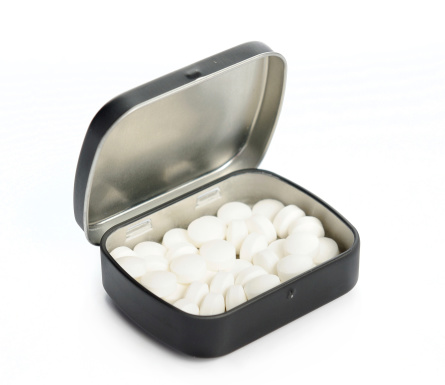 Isolated mint sweets in metal box against the white background