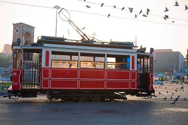 Tram in Taksim Square, Turkey Tram in Taksim Square, Istanbul, Turkey goes from Taksim to Tunel down Istiklal Street. Taksim Square is the site of the environmental and political protests of 2013. police tear gas stock pictures, royalty-free photos & images