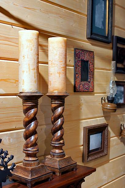 istock Two decorative wooden candlestick on the mantelpiece 454949041