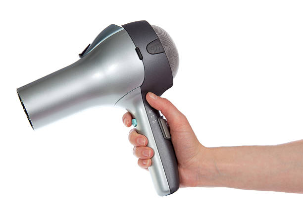 istock The hair dryer in a hand 454953101