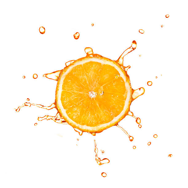 istock Slice of orange with juice splash isolated on white 454953771