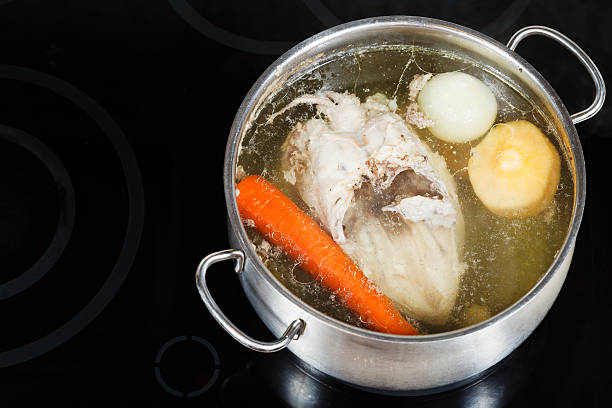 istock boiling of chicken broth on cermic cooker 454954311