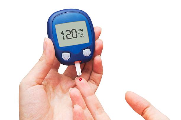 istock Woman doing blood sugar test 454954457