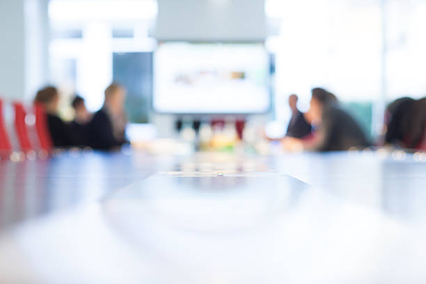 istock Businesspeople at a boardroom table 454958179