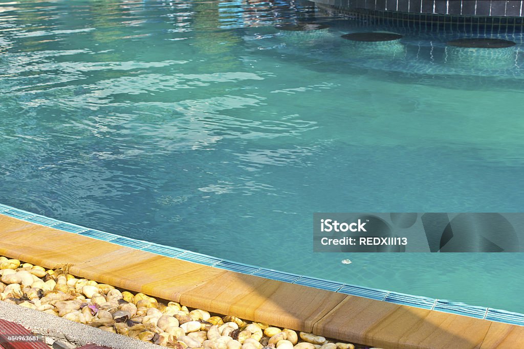Swimming pool 4 Luxury Resort Swimming Pool low angle on curved edge of a luxury resort swimming pool Curve Stock Photo