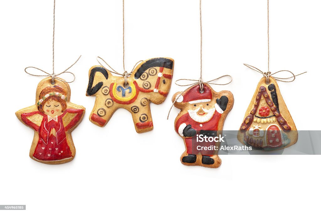 Gingerbread cookies Gingerbread cookies hanging  isolated over white background Gingerbread Cookie Stock Photo