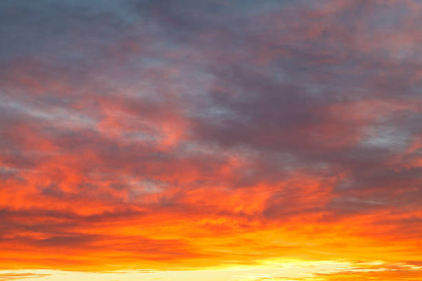 istock bright yellow clouds under blue sky in sunrise 454969245