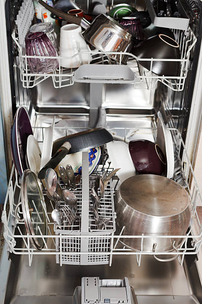 istock dirty cookware in home dishwasher 454969305